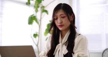 Tokyo Japan 06.19.2022. This working scene is acted by Japanese model in the office. High quality 4k footage