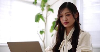 Tokyo Japan 06.19.2022. This working scene is acted by Japanese model in the office. High quality 4k footage