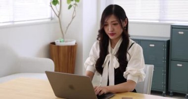 Tokyo Japan 06.19.2022. This working scene is acted by Japanese model in the office. High quality 4k footage