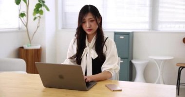 Tokyo Japan 06.19.2022. This working scene is acted by Japanese model in the office. High quality 4k footage