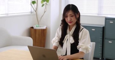 Tokyo Japan 06.19.2022. This working scene is acted by Japanese model in the office. High quality 4k footage