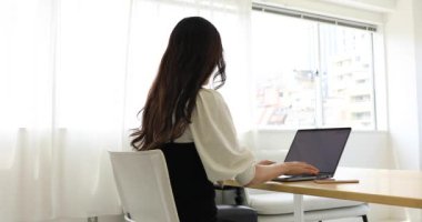Tokyo Japan 06.19.2022. This working scene is acted by Japanese model in the office. High quality 4k footage
