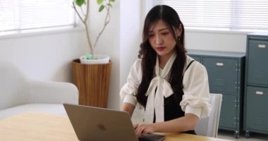 Tokyo Japan 06.19.2022. This working scene is acted by Japanese model in the office. High quality 4k footage
