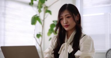 Tokyo Japan 06.19.2022. This working scene is acted by Japanese model in the office. High quality 4k footage