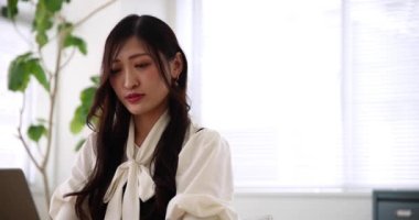 Tokyo Japan 06.19.2022. This working scene is acted by Japanese model in the office. High quality 4k footage