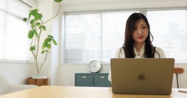 Tokyo Japan 06.19.2022. This working scene is acted by Japanese model in the office. High quality 4k footage