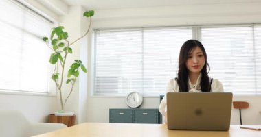 Tokyo Japan 06.19.2022. This working scene is acted by Japanese model in the office. High quality 4k footage