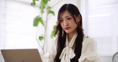 Tokyo Japan 06.19.2022. This working scene is acted by Japanese model in the office. High quality 4k footage