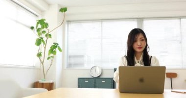 Tokyo Japan 06.19.2022. This working scene is acted by Japanese model in the office. High quality 4k footage