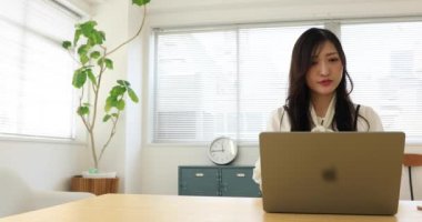 Tokyo Japan 06.19.2022. This working scene is acted by Japanese model in the office. High quality 4k footage