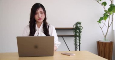 Tokyo Japan 06.19.2022. This working scene is acted by Japanese model in the office. High quality 4k footage