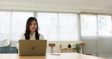 Tokyo Japan 06.19.2022. This working scene is acted by Japanese model in the office. High quality 4k footage