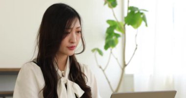 Tokyo Japan 06.19.2022. This working scene is acted by Japanese model in the office. High quality 4k footage