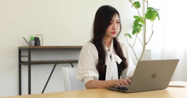 Tokyo Japan 06.19.2022. This working scene is acted by Japanese model in the office. High quality 4k footage