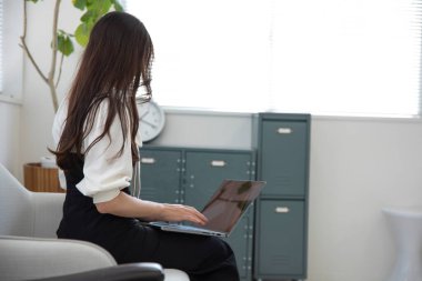 Tokyo Japan 06.19.2022. This working scene is acted by Japanese model in the office. High quality photography