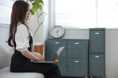 Tokyo Japan 06.19.2022. This working scene is acted by Japanese model in the office. High quality photography