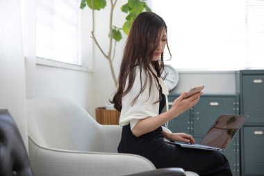 Tokyo Japan 06.19.2022. This working scene is acted by Japanese model in the office. High quality photography