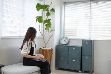 Tokyo Japan 06.19.2022. This working scene is acted by Japanese model in the office. High quality photography