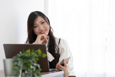 Tokyo Japan 06.19.2022. This working scene is acted by Japanese model in the office. High quality photography