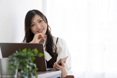 Tokyo Japan 06.19.2022. This working scene is acted by Japanese model in the office. High quality photography