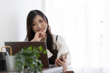 Tokyo Japan 06.19.2022. This working scene is acted by Japanese model in the office. High quality photography