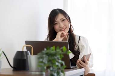 Tokyo Japan 06.19.2022. This working scene is acted by Japanese model in the office. High quality photography