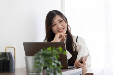Tokyo Japan 06.19.2022. This working scene is acted by Japanese model in the office. High quality photography