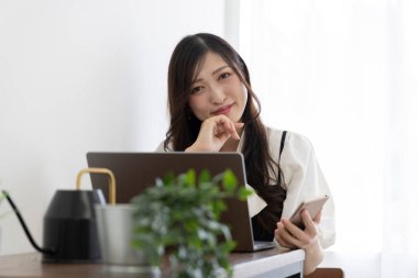 Tokyo Japan 06.19.2022. This working scene is acted by Japanese model in the office. High quality photography