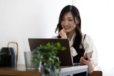 Tokyo Japan 06.19.2022. This working scene is acted by Japanese model in the office. High quality photography