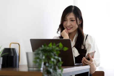 Tokyo Japan 06.19.2022. This working scene is acted by Japanese model in the office. High quality photography