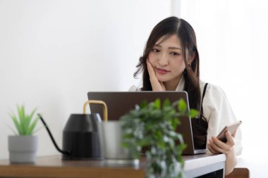 Tokyo Japan 06.19.2022. This working scene is acted by Japanese model in the office. High quality photography