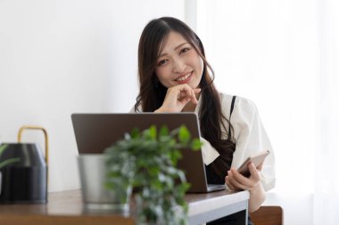 Tokyo Japan 06.19.2022. This working scene is acted by Japanese model in the office. High quality photography