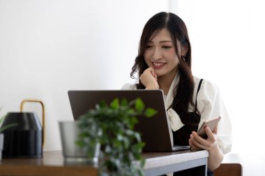 Tokyo Japan 06.19.2022. This working scene is acted by Japanese model in the office. High quality photography