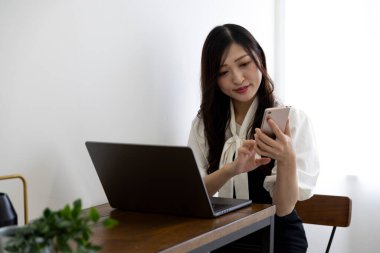 Tokyo Japan 06.19.2022. This working scene is acted by Japanese model in the office. High quality photography