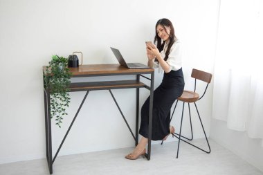 Tokyo Japan 06.19.2022. This working scene is acted by Japanese model in the office. High quality photography