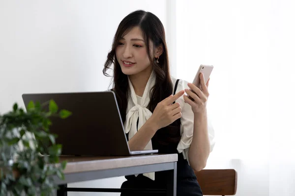 Tokyo Japan 06.19.2022. This working scene is acted by Japanese model in the office. High quality photography