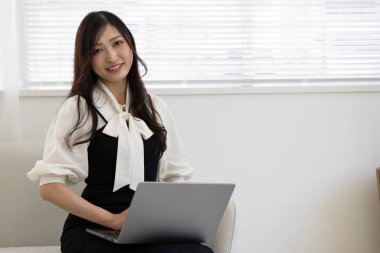 Tokyo Japan 06.19.2022. This working scene is acted by Japanese model in the office. High quality photography