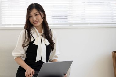 Tokyo Japan 06.19.2022. This working scene is acted by Japanese model in the office. High quality photography