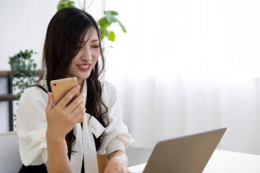 Tokyo Japan 06.19.2022. This working scene is acted by Japanese model in the office. High quality photography