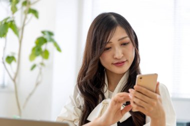 Tokyo Japan 06.19.2022. This working scene is acted by Japanese model in the office. High quality photography