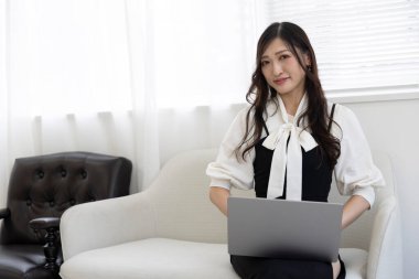 Tokyo Japan 06.19.2022. This working scene is acted by Japanese model in the office. High quality photography