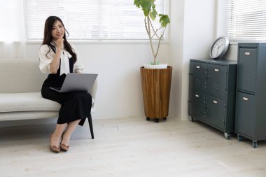 Tokyo Japan 06.19.2022. This working scene is acted by Japanese model in the office. High quality photography