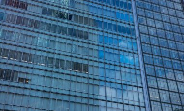 A cloud reflecting the building in the business town long shot. High quality photo. Nakano district Nakanosakaue Tokyo Japan 07.20.2022 Here is a center of the city in Tokyo. 