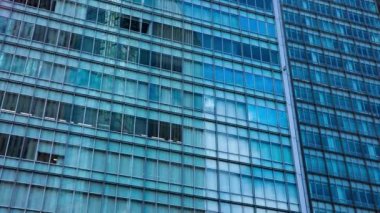 A timelapse of cloud at the building in the business town long shot tilt. High quality 4k footage. Nakano district Nakanosakaue Tokyo Japan 07.20.2022 Here is a center of the city in Tokyo. 
