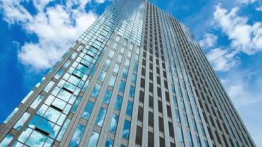 A timelapse of cloud at the building in the business town wide shot zoom. High quality 4k footage. Nakano district Nakanosakaue Tokyo Japan 07.20.2022 Here is a center of the city in Tokyo. 