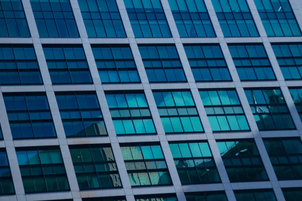 A cloud reflecting the building in the business town long shot. High quality photo. Minato district Shiodome Tokyo Japan 07.25.2022 Here is a center of the city in Tokyo.