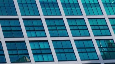 A timelapse of cloud reflecting the building in the business town long shot panning. High quality 4k footage. Minato district Shiodome Tokyo Japan 07.25.2022 Here is a center of the city in Tokyo. 