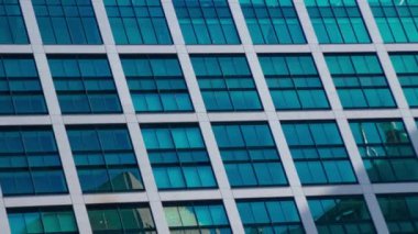 A timelapse of cloud reflecting the building in the business town long shot zoom. High quality 4k footage. Minato district Shiodome Tokyo Japan 07.25.2022 Here is a center of the city in Tokyo. 