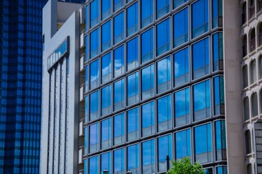 A cloud reflecting the building in the business town long shot. High quality photo. Chiyoda district Koujimachi Tokyo Japan 07.28.2022 Here is a center of the city in Tokyo. 
