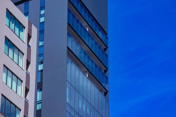 A cloud reflecting the building in the business town long shot. High quality photo. Chiyoda district Koujimachi Tokyo Japan 07.28.2022 Here is a center of the city in Tokyo.